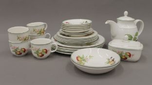 A florally decorated porcelain tea set