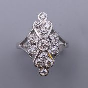 An 18 ct white gold marquis shape diamond ring. Ring size O/P.