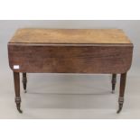 A 19th century mahogany Pembroke table. 112 cm long.