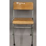 A vintage Bentwood stacking school chair. 40 cm wide.