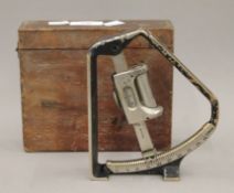 A boxed military Mark IV clinometer. The box 18 cm wide.