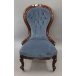 A Victorian mahogany spoon back nursing chair. 60 cm wide.