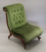 A 19th century upholstered walnut nursing chair. 57 cm wide.