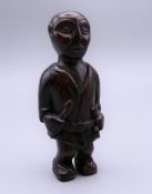 A Japanese netsuke carved as a man. 7 cm high.