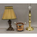 Two table lamps and a twin handled copper vessel. The largest 67 cm high overall.