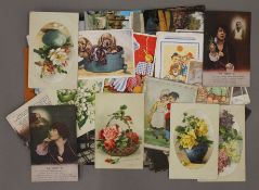 A collection of postcards, including WWI silk postcards.