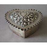 A sterling silver heart shaped box. 12 cm wide. (177.