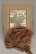 A WWI leather flying helmet; together with a photograph of William Neal Boyle R.F.