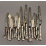 A quantity of various silver handled knives.