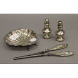 A small quantity of miscellaneous silver items, including a butter shell, a pair of cruets,