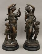 A pair of spelter figural groups. Each 58.5 cm high.