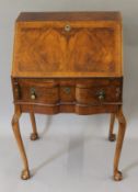 An early 20th century walnut bureau. 60.5 cm wide.