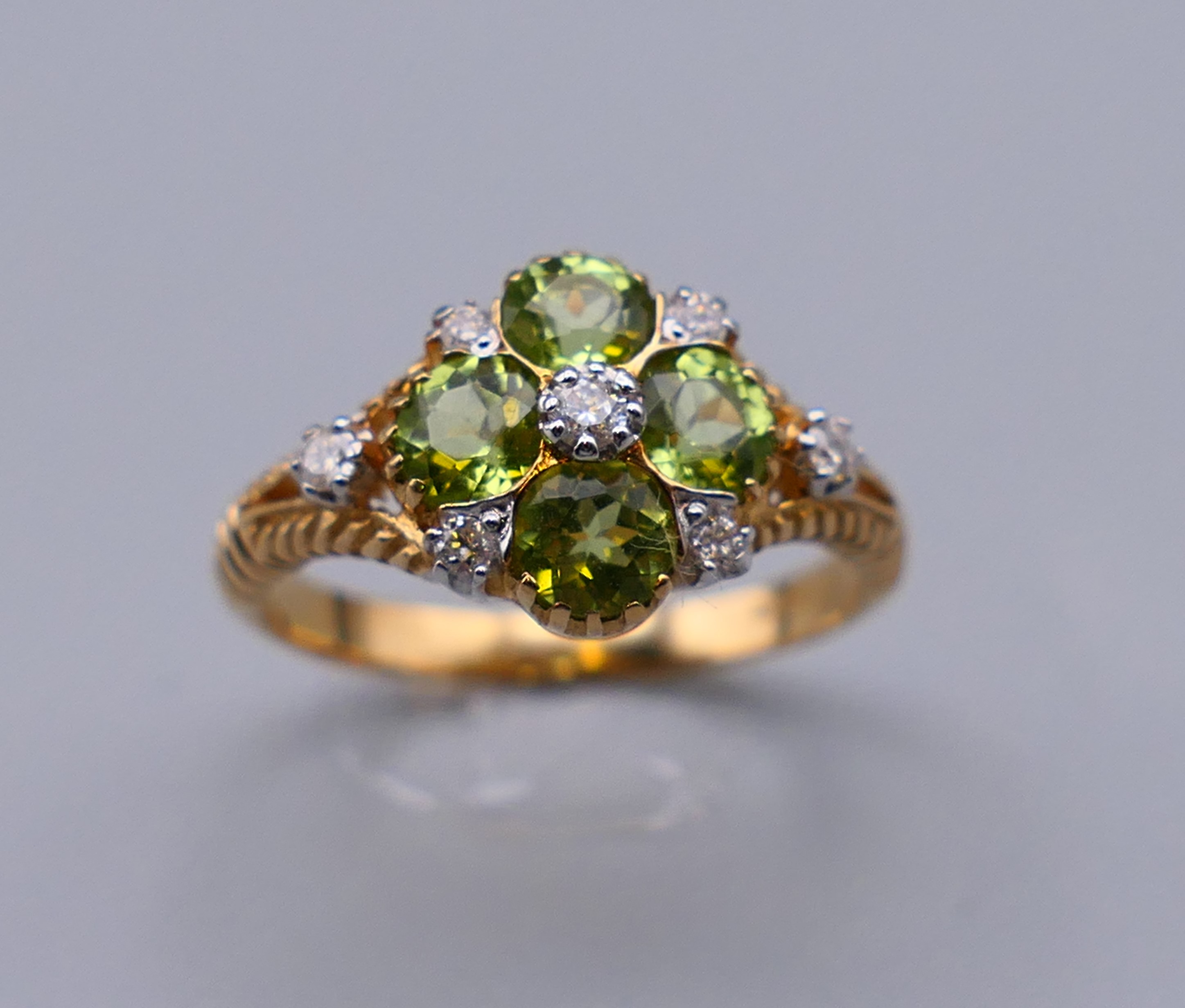 A 9 ct gold Victorian style diamond and peridot ring, engraved design to the sides. Ring size M/N. - Image 3 of 7