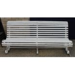 A white painted garden bench.