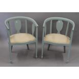 A pair of blue painted tub armchairs. Each 57.5 cm wide.