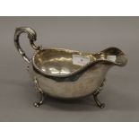 A large silver sauce boat. 21 cm long.