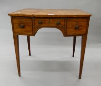 A 19th century mahogany three drawer side table. 76 cm wide.