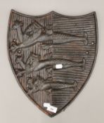 A cast iron shield depicting The Great Yarmouth Coat of Arms. 42 cm high.