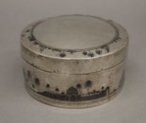 An unmarked Egyptian silver box. 11.5 cm diameter.