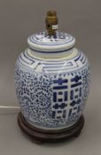 A Chinese blue and white ginger jar converted to a lamp. 35 cm high.