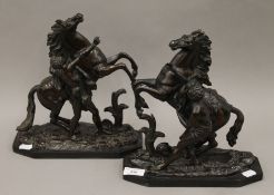 A pair of 19th century patinated bronze Marley horses. Each 27 cm high.