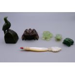 Three jade frogs, a jade bird and a wooden frog. The largest 7 cm high.