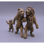 A cold painted bronze model of a lion family. 6.5 cm high.