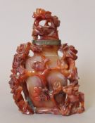 A Chinese carved agate vase. 17 cm high.