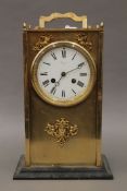 A brass cased mantle clock. 36 cm high.