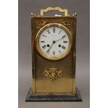 A brass cased mantle clock. 36 cm high.