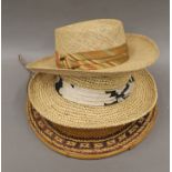 An Oriental straw hat, approximately size 7 1/8 and two straw hats, one by Bailey,