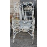 A wire work garden chair.