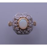 An Art Deco style 9 ct gold, opal and diamond ring. Ring size M/N.