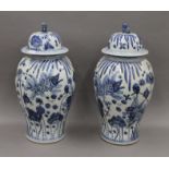 A pair of large Chinese blue and white porcelain lidded vases. 61 cm high.