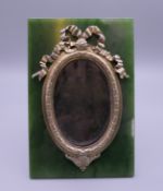 A silver and jade photograph frame, bearing Russian marks. 9.75 x 14.75 cm.