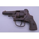 A Hubley cast iron Dandy police 38 revolver cap gun. 14 cm long.