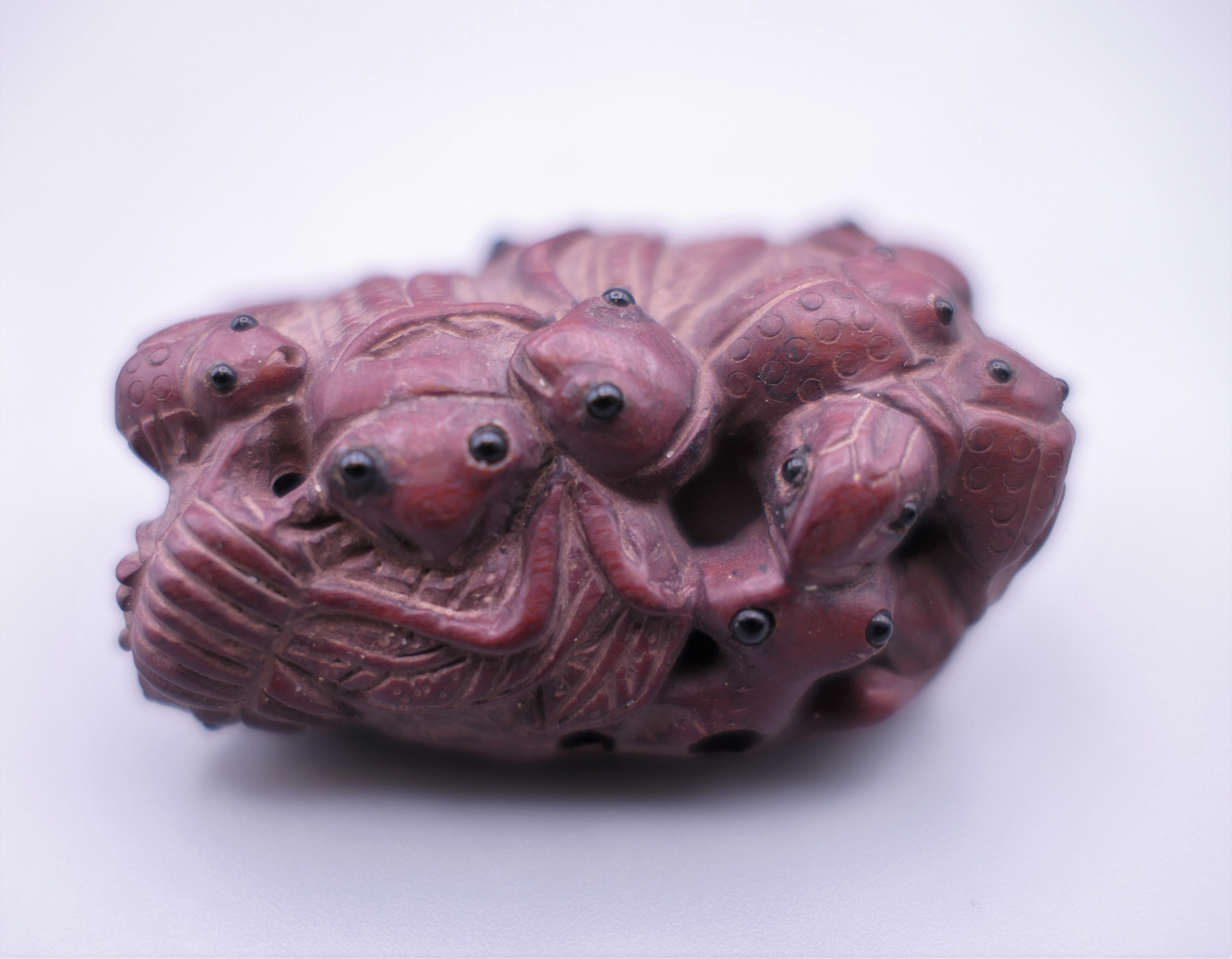 A Japanese netsuke formed as various insects. 5 cm high.