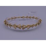 An 18 ct gold bracelet by John Donald. 18.5 cm long. 14.3 grammes.