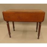 A Victorian mahogany Pembroke table. 87 cm long.