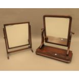 A Victorian mahogany toilet mirror and an Edwardian mahogany toilet mirror. the former 56 cm wide.