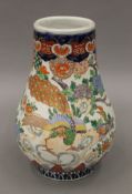 A 19th century Japanese Imari porcelain bulbous shaped vase. 25.5 cm high.