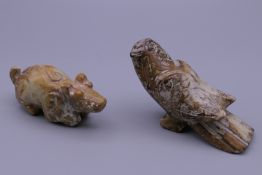 A Chinese carved jade bird and a Chinese carved jade pig. The former 8.5 cm long.