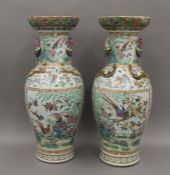 A pair of large 19th century Canton famille rose vases. 64 cm high.