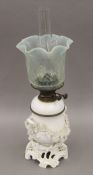 A blanc de chine oil lamp with vaseline glass shade. 56 cm high overall.