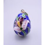 A silver enamel egg pendant. 2.5 cm high.