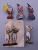 A collection of enamel badges, including Noddy.