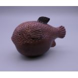A Japanese snuff bottle formed as a puffer fish. 9 cm long.