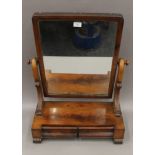 A Victorian mahogany two-drawer toilet mirror. 54 cm wide.