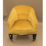 A Victorian upholstered tub chair. 61 cm wide.