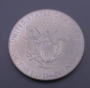 A 2015 US fine silver 1 ounce dollar.